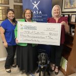 From left: Naomi Strawhorn, Victim Services coordinator at CASA of South Mississippi; Cynthia Chauvin, executive director of CASA of South Mississippi; Remi, CASA courthouse facility dog; and Lisa Birmingham, director of Grants and Scholarships at GCCF.