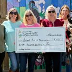 From left: Anne Cieutat Williford; Renee Wieting; Misty Strickland; Lisa Birmingham, director of Grants and Scholarships at GCCF; Mary Bourdin; Meisha (a pup under the care of Animal AID of Mississippi); and Nanette Griffin.